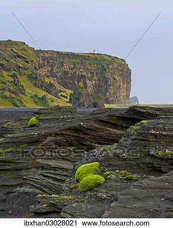 "Tuff rock with a lighthouse, Dyrholaey, Vik i Myrdal, Southern Region, Iceland, Europe" View Large Photo Image Stock Image - "Tuff rock with a lighthouse, Dyrholaey, Vik i Myrdal, Southern Region, Iceland, Europe". Fotosearch