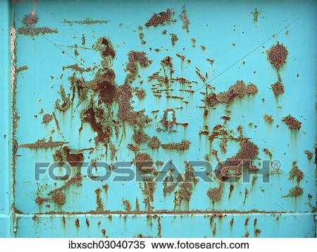 Stock Photography - Turquoise paint is peeling off a rusty surface. Fotosearch