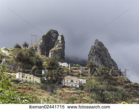 "Twin rock formation, Roques de San Pedro, Hermigua, La Gomera, Canary Islands, Spain, Europe" View Large Photo Image Stock Photography - "Twin rock formation, Roques de San Pedro, Hermigua, La Gomera, Canary Islands, Spain, Europe". Fotosearch
