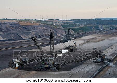 "Two bucket-wheel excavators in an open pit, Grevenbroich, North Rhine-Westphalia, Germany, Europe" View Large Photo Image Stock Image - "Two bucket-wheel excavators in an open pit, Grevenbroich, North Rhine-Westphalia, Germany, Europe". Fotosearch