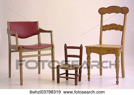 Two chairs and a children's chair View Large Photo Image Stock Photo - Two chairs and a children's chair. Fotosearch