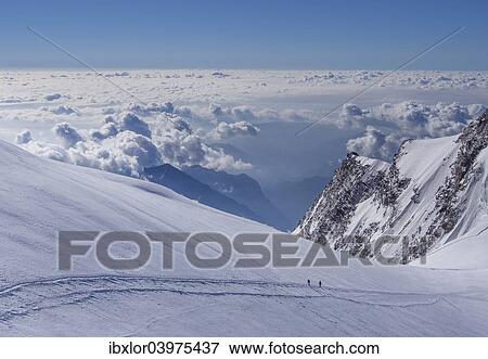 "Two climbers above the clouds on Monte Rosa, Alps, Valle d'Aosta, Italy, Europe" View Large Photo Image Stock Photo - "Two climbers above the clouds on Monte Rosa, Alps, Valle d'Aosta, Italy, Europe". Fotosearch