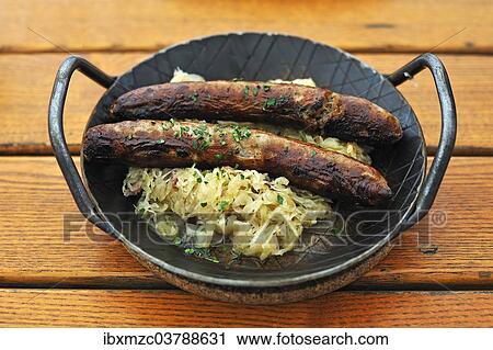 "Two Franconian sausages with sauerkraut on an iron plate in a garden restaurant, Rothenburg ob der Tauber, Middle Franconia, Bavaria, Germany, Europe" View Large Photo Image Stock Image - "Two Franconian sausages with sauerkraut on an iron plate in a garden restaurant, Rothenburg ob der Tauber, Middle Franconia, Bavaria, Germany, Europe". Fotosearch