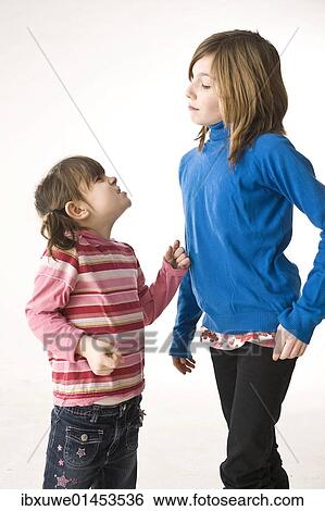 Two girls arguing View Large Photo Image Stock Photograph - Two girls arguing. Fotosearch
