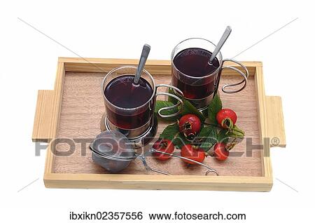 Two glasses of rose hip tea and rose hips on a wooden tray View Large Photo Image Stock Photograph - Two glasses of rose hip tea and rose hips on a wooden tray. Fotosearch