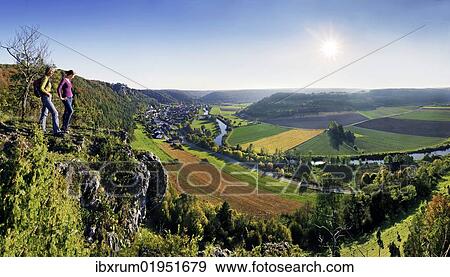 "Two hikers looking on the Altmuehltal valley in Arnsberg, Naturpark Altmuehltal nature forest, Bavaria, Germany, Europe" View Large Photo Image Stock Photo - "Two hikers looking on the Altmuehltal valley in Arnsberg, Naturpark Altmuehltal nature forest, Bavaria, Germany, Europe". Fotosearch