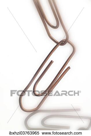 Stock Photography - Two linked paperclips. Fotosearch