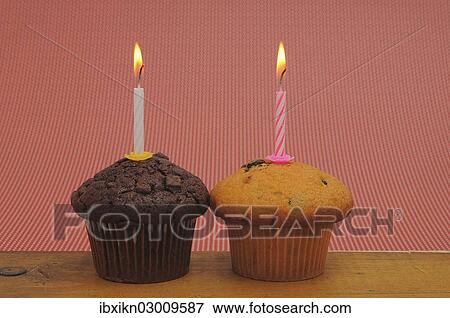 Two muffins with birthday candles View Large Photo Image Stock Photo - Two muffins with birthday candles. Fotosearch