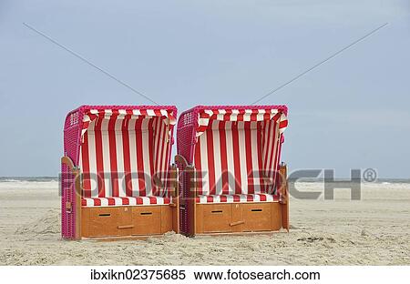 "Two red beach chairs, Amrum island, North Sea beach, Schleswig-Holstein, Germany, Europe" View Large Photo Image Stock Photography - "Two red beach chairs, Amrum island, North Sea beach, Schleswig-Holstein, Germany, Europe". Fotosearch