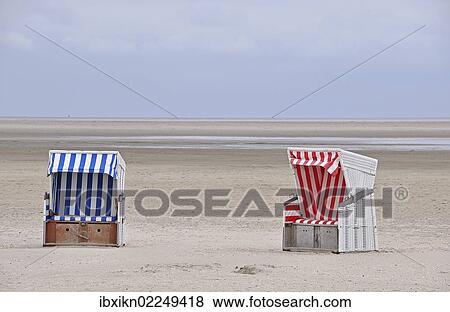 "Two roofed wicker beach chairs, beach on the North Sea, St. Peter-Ording, Schleswig-Holstein, Germany, Europe" View Large Photo Image Stock Photo - "Two roofed wicker beach chairs, beach on the North Sea, St. Peter-Ording, Schleswig-Holstein, Germany, Europe". Fotosearch