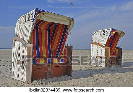 "Two roofed wicker beach chairs, North Sea, Amrum, Schleswig-Holstein, Germany, Europe" View Large Photo Image Stock Photo - "Two roofed wicker beach chairs, North Sea, Amrum, Schleswig-Holstein, Germany, Europe". Fotosearch