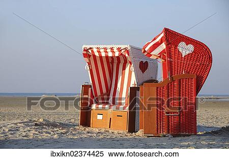 "Two roofed wicker beach chairs, North Sea, Amrum, Schleswig-Holstein, Germany, Europe" View Large Photo Image Stock Photography - "Two roofed wicker beach chairs, North Sea, Amrum, Schleswig-Holstein, Germany, Europe". Fotosearch