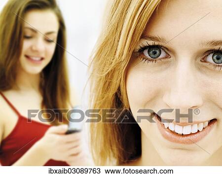 "Two smiling young women, friends" View Large Photo Image Stock Image - "Two smiling young women, friends". Fotosearch