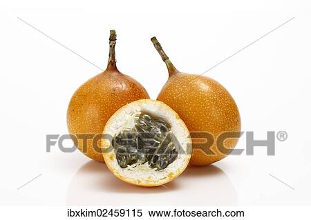 Two whole and one half of a Granadilla or Passion Fruit (Passiflora caerulea) View Large Photo Image Stock Photography - Two whole and one half of a Granadilla or Passion Fruit (Passiflora caerulea). Fotosearch