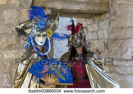 Two women wearing Venetian masks and costumes View Large Photo Image Picture - Two women wearing Venetian masks and costumes. Fotosearch