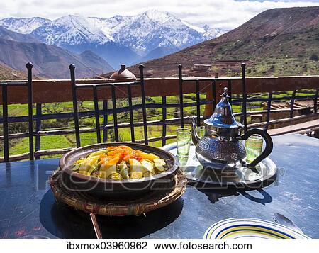 Stock Image - "Typical clay pot, tajine, for cooking traditional Moroccan meals, mud-brick village of Anammer, Ourika Valley, Atlas Mountains, Anammer, Marrakech-Tensift-Al Haouz, Morocco, Africa". Fotosearch