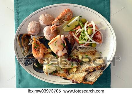 "Typical fish dish with shrimps, mussels, whiting, octopus, boiled potatoes, Lanzarote, Canary Islands, Spain, Europe" View Large Photo Image Stock Photography - "Typical fish dish with shrimps, mussels, whiting, octopus, boiled potatoes, Lanzarote, Canary Islands, Spain, Europe". Fotosearch