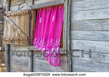 "Typical house with pink curtain, Betany village, Morondava, Toliara province, Madagascar, Africa" View Large Photo Image Stock Photo - "Typical house with pink curtain, Betany village, Morondava, Toliara province, Madagascar, Africa". Fotosearch