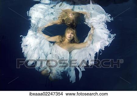 "Underwater model presenting fashion in pool, Odessa, Ukraine, Eastern Europe, Europe" View Large Photo Image Picture - "Underwater model presenting fashion in pool, Odessa, Ukraine, Eastern Europe, Europe". Fotosearch