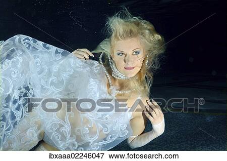 "Underwater model presenting fashion in pool, Odessa, Ukraine, Eastern Europe, Europe" View Large Photo Image Stock Photo - "Underwater model presenting fashion in pool, Odessa, Ukraine, Eastern Europe, Europe". Fotosearch