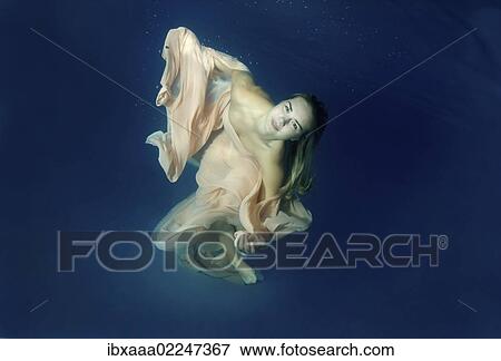 Stock Photo - "Underwater model presenting fashion in pool, Odessa, Ukraine, Eastern Europe, Europe". Fotosearch
