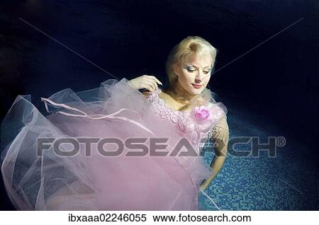 Stock Photography - "Underwater model presenting fashion in pool, Odessa, Ukraine, Eastern Europe, Europe". Fotosearch