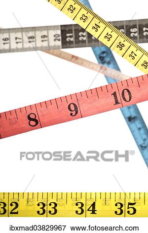 Various colourful tape measures criss-crossing over each other View Large Photo Image Stock Photo - Various colourful tape measures criss-crossing over each other. Fotosearch