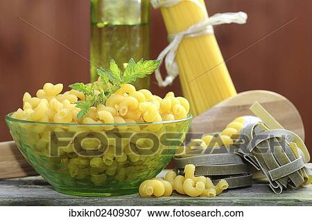 Various types of pasta with a glass bowl View Large Photo Image Stock Photo - Various types of pasta with a glass bowl. Fotosearch