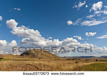 "Vast arid landscape, blue sky with clouds, Isalo National Park near Ranohira, Madagascar, Africa" View Large Photo Image Stock Image - "Vast arid landscape, blue sky with clouds, Isalo National Park near Ranohira, Madagascar, Africa". Fotosearch