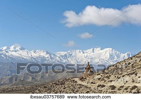 "Vast landscape with stupa, the snow-covered mountains of the Annapurna Range at back, near Geling, Upper Mustang, Lo, Nepal, Asia" View Large Photo Image Stock Photo - "Vast landscape with stupa, the snow-covered mountains of the Annapurna Range at back, near Geling, Upper Mustang, Lo, Nepal, Asia". Fotosearch
