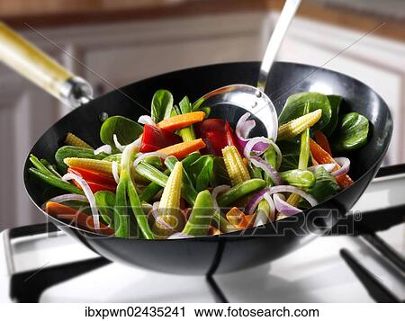 Vegetable stir-fry in a wok View Large Photo Image Stock Image - Vegetable stir-fry in a wok. Fotosearch