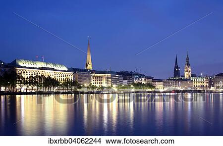 "View across the Inner Alster towards representative office buildings, hotels, and commercial buildings on Jungfernstieg promenade, Hamburg, Germany, Europe" View Large Photo Image Picture - "View across the Inner Alster towards representative office buildings, hotels, and commercial buildings on Jungfernstieg promenade, Hamburg, Germany, Europe". Fotosearch
