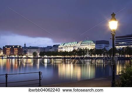 "View across the Inner Alster towards representative office buildings, hotels, and commercial buildings on Jungfernstieg promenade, Hamburg, Germany, Europe" View Large Photo Image Stock Image - "View across the Inner Alster towards representative office buildings, hotels, and commercial buildings on Jungfernstieg promenade, Hamburg, Germany, Europe". Fotosearch