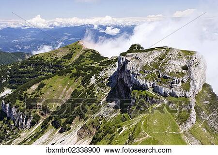 Stock Image - "View during a round trip hike in the Tre Cime del Monte Bondone nature reserve, towards Cornetto Mountain with Dos d'Abramo Mountain and Cima Verde Mountain at the rear, Trentino, Italy, Europe". Fotosearch