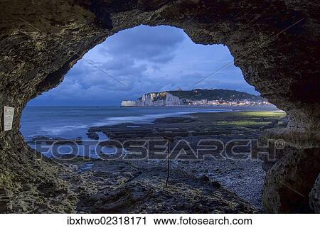 "View from a cave to the coast at low tide, dusk, cliffs of Porte d'Amont with the church of Notre-Dame de la Garde at back, Alabaster Coast, Upper Normandy, France, Europe" View Large Photo Image Stock Image - "View from a cave to the coast at low tide, dusk, cliffs of Porte d'Amont with the church of Notre-Dame de la Garde at back, Alabaster Coast, Upper Normandy, France, Europe". Fotosearch