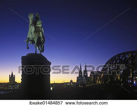 "View from Deutz, Gross St. Martin church, equestrian statue of Kaiser Wilhelm I of Prussia, Cologne Cathedral and Hohenzollernbruecke bridge, blue hour, evening, illuminated, Cologne, North Rhine-Westphalia, Germany, Europe" View Large Photo Image Stock Photo - "View from Deutz, Gross St. Martin church, equestrian statue of Kaiser Wilhelm I of Prussia, Cologne Cathedral and Hohenzollernbruecke bridge, blue hour, evening, illuminated, Cologne, North Rhine-Westphalia, Germany, Europe". Fotosearch