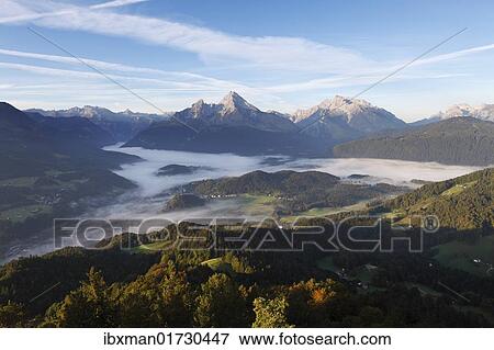 "View from Kneifelspitze mountain across Berchtesgaden towards Watzmann and Hochkalter mountains, in the morning, Berchtesgaden Alps, Berchtesgadener Land district, Upper Bavaria, Germany, Europe" View Large Photo Image Stock Photo - "View from Kneifelspitze mountain across Berchtesgaden towards Watzmann and Hochkalter mountains, in the morning, Berchtesgaden Alps, Berchtesgadener Land district, Upper Bavaria, Germany, Europe". Fotosearch