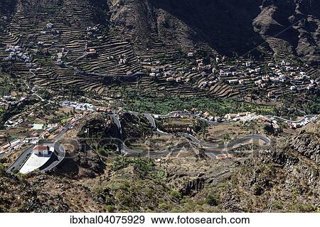 "View from Mirador Cesar Manrique onto terraced fields and houses of Hornillo and Los Reyes, Valle Gran Rey, La Gomera, Canary Islands, Spain, Europe" View Large Photo Image Stock Photo - "View from Mirador Cesar Manrique onto terraced fields and houses of Hornillo and Los Reyes, Valle Gran Rey, La Gomera, Canary Islands, Spain, Europe". Fotosearch