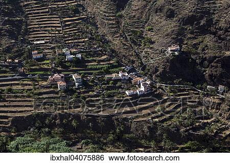 "View from Mirador Cesar Manrique onto terraced fields and houses of Los Reyes, Valle Gran Rey, La Gomera, Canary Islands, Spain, Europe" View Large Photo Image Stock Photograph - "View from Mirador Cesar Manrique onto terraced fields and houses of Los Reyes, Valle Gran Rey, La Gomera, Canary Islands, Spain, Europe". Fotosearch
