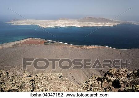 "View from Mirador del Rio on the Salinos del Rio and Isla Graciosa, Lanzarote, Canary Islands, Spain, Europe" View Large Photo Image Stock Image - "View from Mirador del Rio on the Salinos del Rio and Isla Graciosa, Lanzarote, Canary Islands, Spain, Europe". Fotosearch