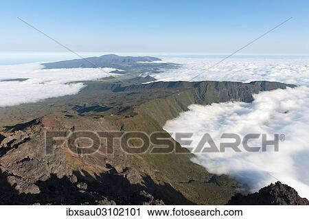 "View from Mount Piton des Neiges towards Mount Piton de la Fournaise volcano, near Cilaos, La Reunion, Reunion, Indischer Ozean, Afrika, Africa" View Large Photo Image Stock Image - "View from Mount Piton des Neiges towards Mount Piton de la Fournaise volcano, near Cilaos, La Reunion, Reunion, Indischer Ozean, Afrika, Africa". Fotosearch