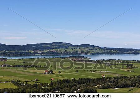 Stock Photo - "View from mount Tegelberg to Forggensee Lake and Illasbergsee Lake, Upper Bavaria, Bavaria, Germany, Europe". Fotosearch