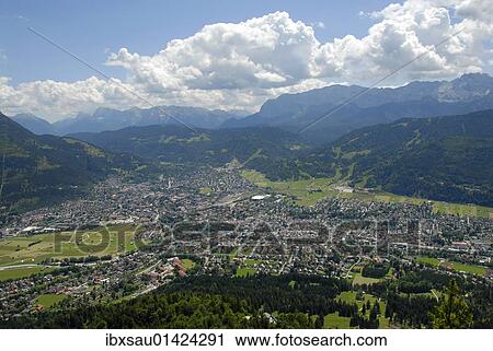 "View from Mt. Kramer or Mt. Kramerspitz on Garmisch-Partenkirchen, Mt. Zugspitze and Wettersteingebirge mountain range in the back, Werdenfelser Land area, Upper Bavaria, Bavaria, Germany, Europe" View Large Photo Image Stock Image - "View from Mt. Kramer or Mt. Kramerspitz on Garmisch-Partenkirchen, Mt. Zugspitze and Wettersteingebirge mountain range in the back, Werdenfelser Land area, Upper Bavaria, Bavaria, Germany, Europe". Fotosearch
