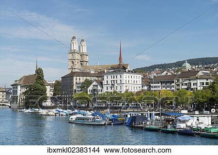 Picture - "View from Quaibruecke bridge over the Limmat river to the marina with the Limmat quay, the twin towers of the Grossmuenster church at back, Zurich, Canton of Zurich, Switzerland, Europe". Fotosearch