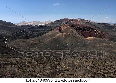 "View from the Caldera Blanca volcano on the volcanic landscape of the Timanfaya National Park, Fire Mountains, volcanoes, Lanzarote, Canary Islands, Spain, Europe" View Large Photo Image Stock Image - "View from the Caldera Blanca volcano on the volcanic landscape of the Timanfaya National Park, Fire Mountains, volcanoes, Lanzarote, Canary Islands, Spain, Europe". Fotosearch