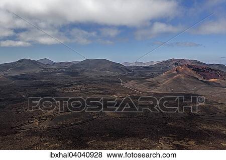 "View from the Caldera Blanca volcano on the volcanic landscape of the Timanfaya National Park, Fire Mountains, volcanoes, Lanzarote, Canary Islands, Spain, Europe" View Large Photo Image Stock Photo - "View from the Caldera Blanca volcano on the volcanic landscape of the Timanfaya National Park, Fire Mountains, volcanoes, Lanzarote, Canary Islands, Spain, Europe". Fotosearch