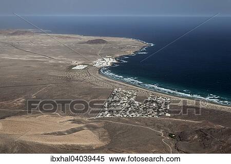 "View from the Ermita de las Nieves on the Risco de Famara on the beach Playa de Famara, Famara resort, La Calaeta and El Jable, Lanzarote, Canary Islands, Spain, Europe" View Large Photo Image Stock Photography - "View from the Ermita de las Nieves on the Risco de Famara on the beach Playa de Famara, Famara resort, La Calaeta and El Jable, Lanzarote, Canary Islands, Spain, Europe". Fotosearch
