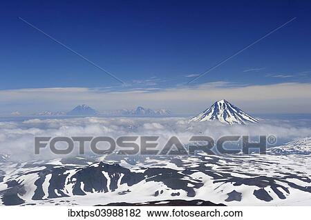 Stock Image - "View from the Gorely volcano to the Tolmachev Dol and Opala volcanoes, Kamchatka Peninsula, Russia, Europe". Fotosearch