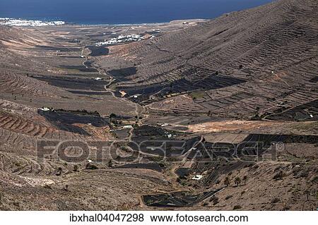 "View from the Mirador de Haria into the Valle de Temisa, terraced fields, agriculture, villages of Tabayesce and Arrieta at the back, Lanzarote, Canary Islands, Spain, Europe" View Large Photo Image Stock Photo - "View from the Mirador de Haria into the Valle de Temisa, terraced fields, agriculture, villages of Tabayesce and Arrieta at the back, Lanzarote, Canary Islands, Spain, Europe". Fotosearch