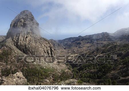 "View from the Mirador de Roque Agando onto the Roque de Agando, La Gomera, Canary Islands, Spain, Europe" View Large Photo Image Stock Photograph - "View from the Mirador de Roque Agando onto the Roque de Agando, La Gomera, Canary Islands, Spain, Europe". Fotosearch